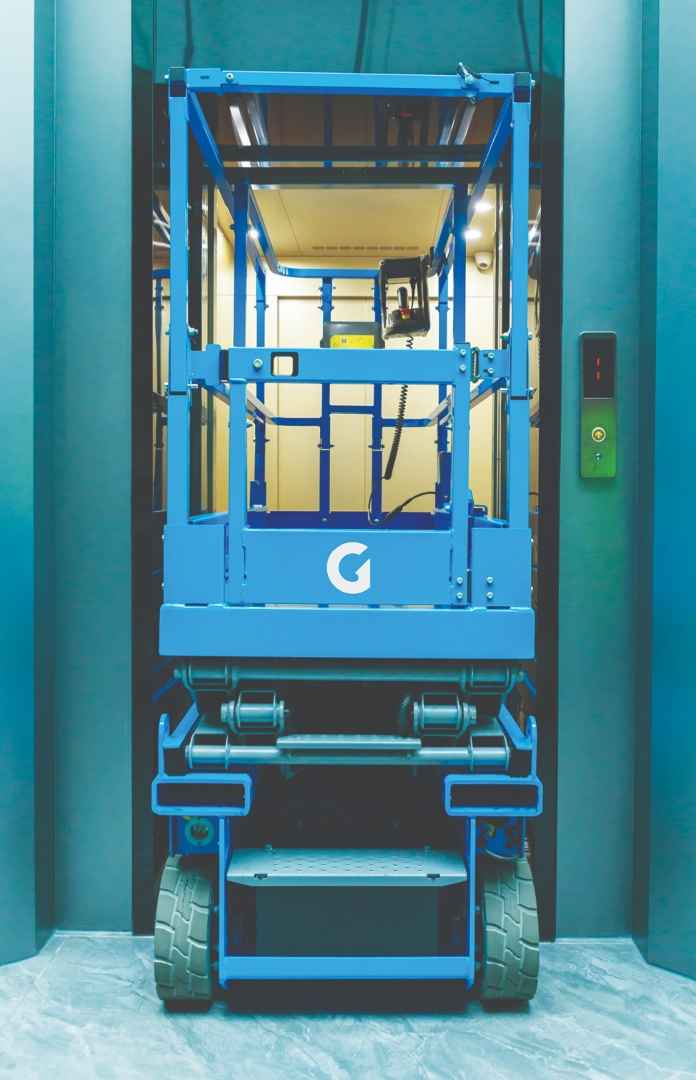 Genie lift going through a doorway